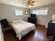 Bright bedroom with hardwood floors, neutral walls, and ample natural light at 7124 Linda Lake Dr, Charlotte, NC 28215