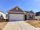 Newly built home with 2-car garage and well-manicured lawn at 7192 Indigo Way, Denver, NC 28037