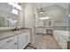 Main bathroom with dual vanities and a whirlpool tub, offering a spa-like experience at 8011 S Dorchester Trce, Indian Land, SC 29707