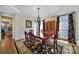 Elegant dining room features crown molding, hardwood floors, chandelier, and stylish decor at 8011 S Dorchester Trce, Indian Land, SC 29707