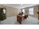 This home office features a large desk and an antique cabinet for extra storage at 8011 S Dorchester Trce, Indian Land, SC 29707