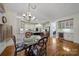 Bright eat-in kitchen features an island, stainless steel appliances and a chandelier at 8011 S Dorchester Trce, Indian Land, SC 29707