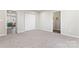 Bright bedroom with neutral carpet and access to hallway at 806 S Martin Luther King Ave, Salisbury, NC 28144