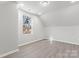 Charming bedroom with sloped ceilings and a window at 806 S Martin Luther King Ave, Salisbury, NC 28144