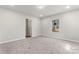 Spacious bedroom with neutral carpeting and ample natural light at 806 S Martin Luther King Ave, Salisbury, NC 28144