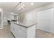Modern kitchen with island, white cabinets and granite countertops at 806 S Martin Luther King Ave, Salisbury, NC 28144