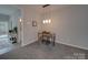 Cozy dining area featuring modern pendant lighting, and neutral carpet and walls at 8065 Stoneham Ct, Matthews, NC 28105