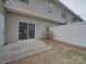 Back patio featuring sliding glass doors and a fenced-in yard at 8065 Stoneham Ct, Matthews, NC 28105