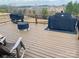 View of the deck which has lawn furniture, a grill, and a view of the neighborhood at 8906 Powder Works Dr, Huntersville, NC 28078