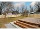 A view of the backyard, which features a new fence and deck at 915 Tilden Rd, Charlotte, NC 28214