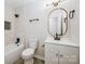 Clean bathroom with white vanity, oval mirror, and bathtub at 915 Tilden Rd, Charlotte, NC 28214