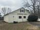 Exterior view of outbuilding featuring large doors, and a simple window above at 918 Old Lilesville Rd, Wadesboro, NC 28170