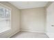 A bright bedroom with neutral walls, carpeted floor and ample natural light from the window at 985 Dunlap Roddey Rd, Rock Hill, SC 29730