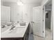 Bathroom featuring double vanity, framed mirrors and tile flooring at 1201 Township Pkwy, Belmont, NC 28012