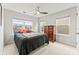 Bedroom featuring ceiling fan, dresser and multiple windows at 1201 Township Pkwy, Belmont, NC 28012