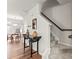 A bright foyer with a staircase and a view of the dining room at 1201 Township Pkwy, Belmont, NC 28012