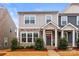 Charming two-story townhome with stone accents and a cozy front porch at 1201 Township Pkwy, Belmont, NC 28012