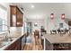 Kitchen with granite countertops, stainless steel appliances, and dark wood cabinets at 1201 Township Pkwy, Belmont, NC 28012