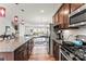 Modern kitchen features stainless steel appliances, granite countertops, and open view to the living room at 1201 Township Pkwy, Belmont, NC 28012