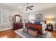 Bedroom features hardwood floors, a wooden bed frame, and a decorative area rug at 1335 E Marion St, Shelby, NC 28150