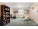 Bonus room featuring large window, exercise equipment, and built in bookshelf at 1335 E Marion St, Shelby, NC 28150