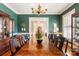 Formal dining room featuring an oversized table, hardwood floors, and tasteful decor at 1335 E Marion St, Shelby, NC 28150