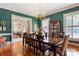 Elegant dining room with green wall coverings and a large table, ideal for entertaining guests at 1335 E Marion St, Shelby, NC 28150