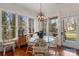 Dining area with large windows and a glass-top table, flooded with natural light at 1335 E Marion St, Shelby, NC 28150