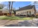 Exterior view showcasing the house, carport, and landscaping at 1335 E Marion St, Shelby, NC 28150