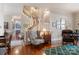 Inviting foyer with hardwood floors, staircase, and decorated with artwork at 1335 E Marion St, Shelby, NC 28150