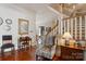 Inviting foyer with wood floors, staircase, and traditional decor at 1335 E Marion St, Shelby, NC 28150