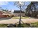 Beautiful home with a circular driveway, mature trees, a brick carport, and a well-kept lawn at 1335 E Marion St, Shelby, NC 28150