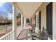 Relaxing front porch featuring rocking chairs and classic architectural details with white railing at 1335 E Marion St, Shelby, NC 28150