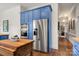 Kitchen featuring blue cabinets, stainless steel appliances, and wood countertops at 1335 E Marion St, Shelby, NC 28150