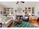 Bright living room with fireplace, built-in shelving, and hardwood floors at 1335 E Marion St, Shelby, NC 28150