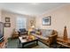 Cozy living room featuring natural lighting, a futon sofa, and side tables at 1335 E Marion St, Shelby, NC 28150
