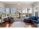 Bright sunroom with large windows and a cozy seating area at 1335 E Marion St, Shelby, NC 28150