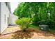 Exterior view showcasing a well-maintained backyard with lush greenery at 1748 Pergola Pl, Charlotte, NC 28213