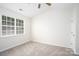 Bright bedroom with a large window, vaulted ceiling, and plush carpeting at 1748 Pergola Pl, Charlotte, NC 28213