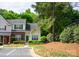 Inviting townhome with well-maintained landscaping, a neatly paved parking area, and a harmonious exterior color scheme at 1748 Pergola Pl, Charlotte, NC 28213