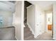 Hallway featuring the main staircase and access to the upstairs bedrooms at 1748 Pergola Pl, Charlotte, NC 28213