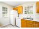 The bright kitchen features lots of counter space and a modern refrigerator at 1748 Pergola Pl, Charlotte, NC 28213