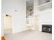 Inviting living room with a soaring ceiling, a fireplace, and an open layout leading to the upper level at 1748 Pergola Pl, Charlotte, NC 28213