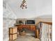 Attic office area with sloped ceilings, desk and adjacent desk storage at 1902 Old Wilkesboro Rd, Statesville, NC 28625
