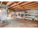 Spacious unfinished basement with exposed ductwork and lots of open storage on shelving at 1902 Old Wilkesboro Rd, Statesville, NC 28625