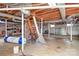 Unfinished basement offers ample storage, exposed beams, and room for customization at 1902 Old Wilkesboro Rd, Statesville, NC 28625