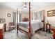 Cozy bedroom featuring a classic four-poster bed and ceiling fan at 1902 Old Wilkesboro Rd, Statesville, NC 28625