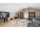 Versatile bonus room under the eaves with TV, carpet, and a geometric patterned rug at 1902 Old Wilkesboro Rd, Statesville, NC 28625