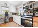 Well-lit kitchen featuring white cabinets, stainless steel appliances, and a window view at 1902 Old Wilkesboro Rd, Statesville, NC 28625