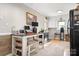 Bright kitchen featuring a breakfast bar with stools and updated appliances at 1902 Old Wilkesboro Rd, Statesville, NC 28625